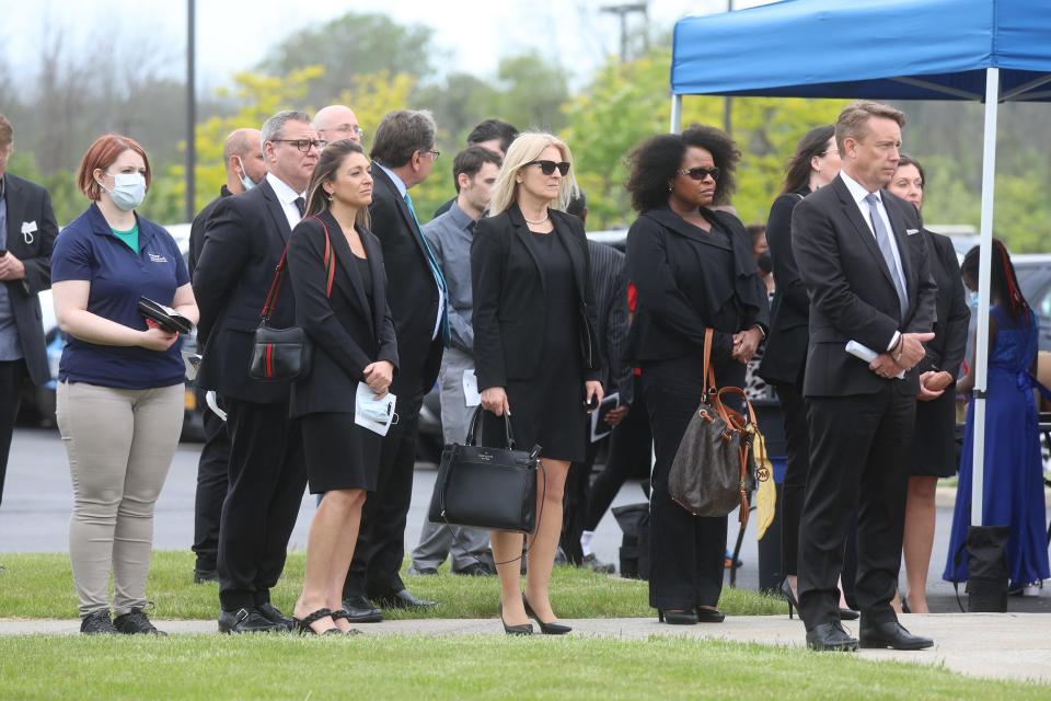 Family and friends gather outside for a ceremony for Aaron Salter Jr. outside The Chapel in Getzville, NY May 25, 2022 before they leave to head to the cemetery.   Salter was killed in a racially motivated shooting at Tops Friendly Market on Jefferson Ave. in Buffalo on May 14.