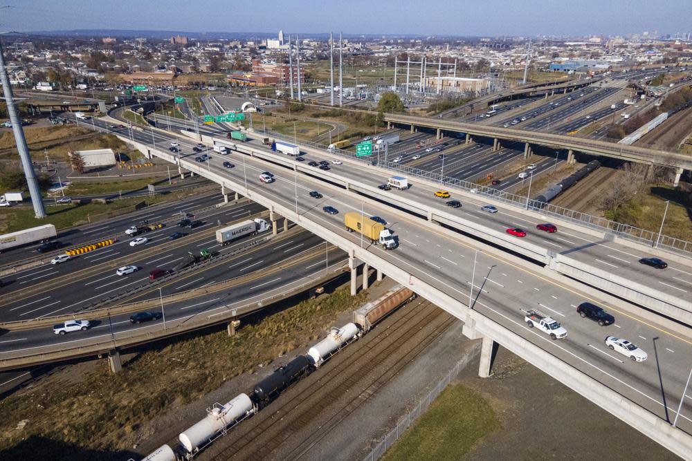 Drivers travel on the New Jersey Turnpike and connecting roads in Elizabeth, New Jersey, on Wednesday, Nov. 23, 2022. AAA predicts that nearly 55 million people in the U.S. will travel at least 50 miles from home this week, an increase over last year and only 2% less than in 2019.(AP Photo/Ted Shaffrey)
