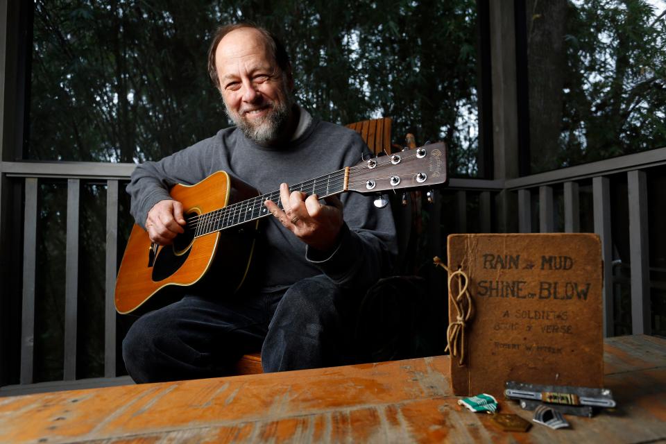 Bob McPeek wrote a song based on one of his father's World War II poems, "Sunset on the Prairie," after a book of his dad's poetry was found in the rafters of his home years after his father's passing. McPeek is shown at his residence in Gainesville in 2013.
