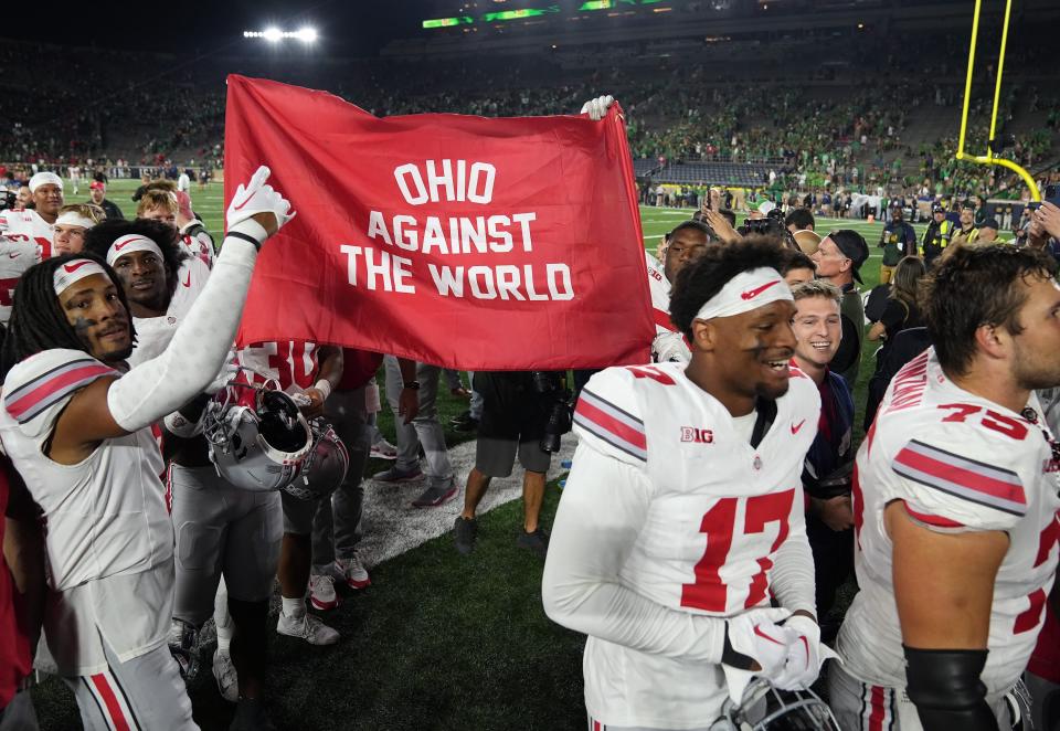 Ohio State players celebrate as they leave the field after defeating Notre Dame.