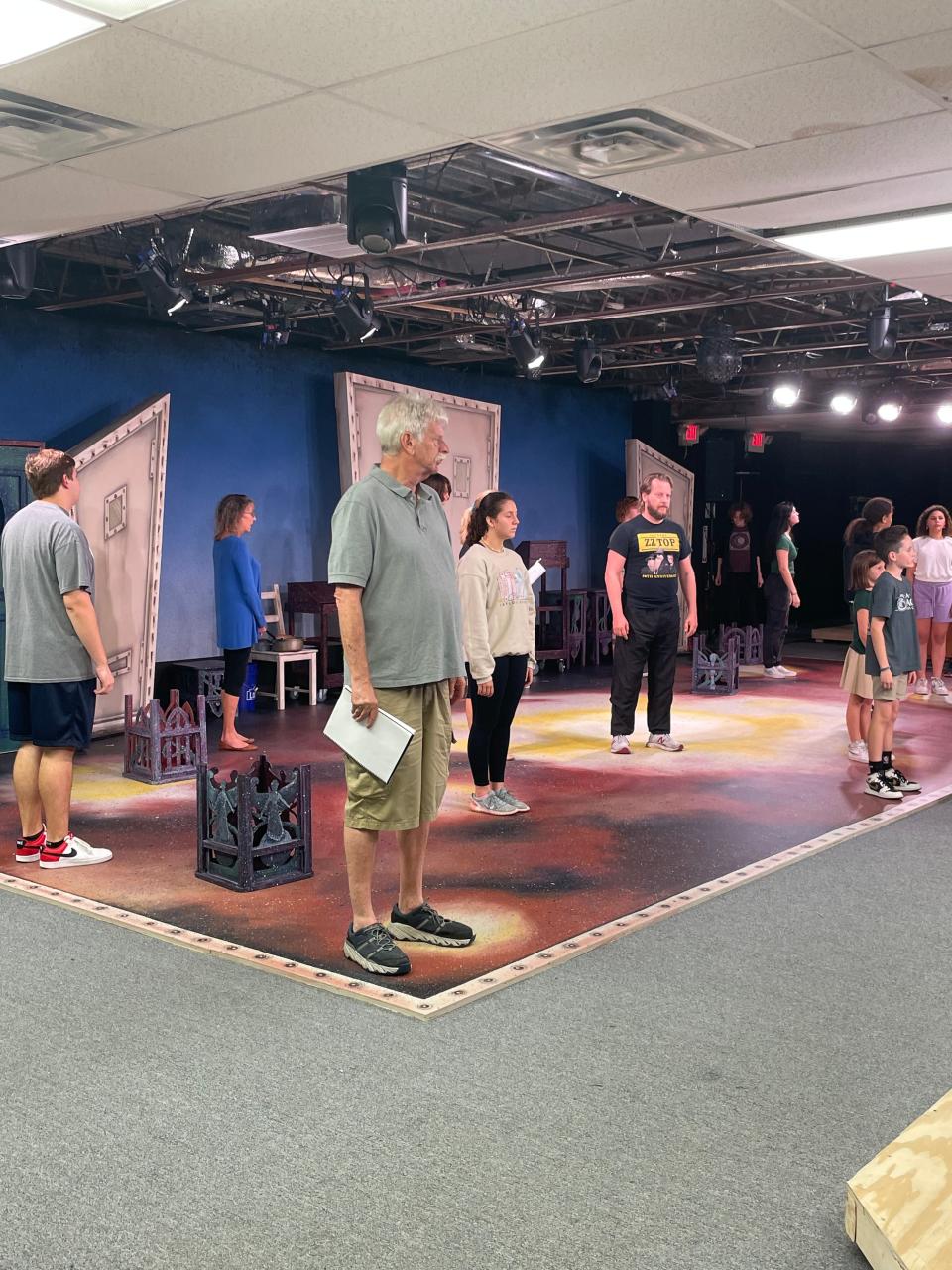 Neil Kasanofsky, center, as Fezziwig, and other cast members rehearse a scene from the Venice Theatre’s production of “A Christmas Carol” in a new performance space.