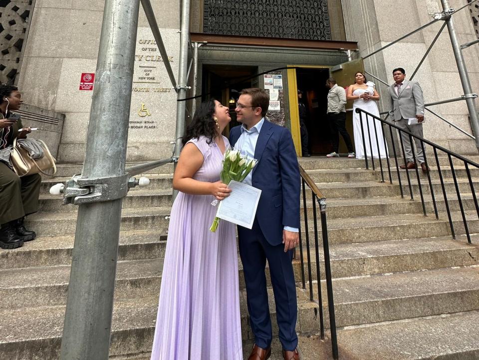 Chandler Dean and Carolina Treviño celebrate after their courthouse wedding.