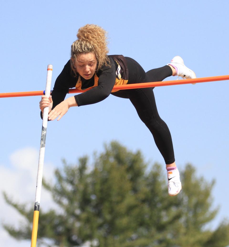 Watkins Memorial senior Victoria Harvey clears the bar in the pole vault during the Watkins Icebreaker on April 1. Harvey won the event with a height of 12 feet, 6 inches.