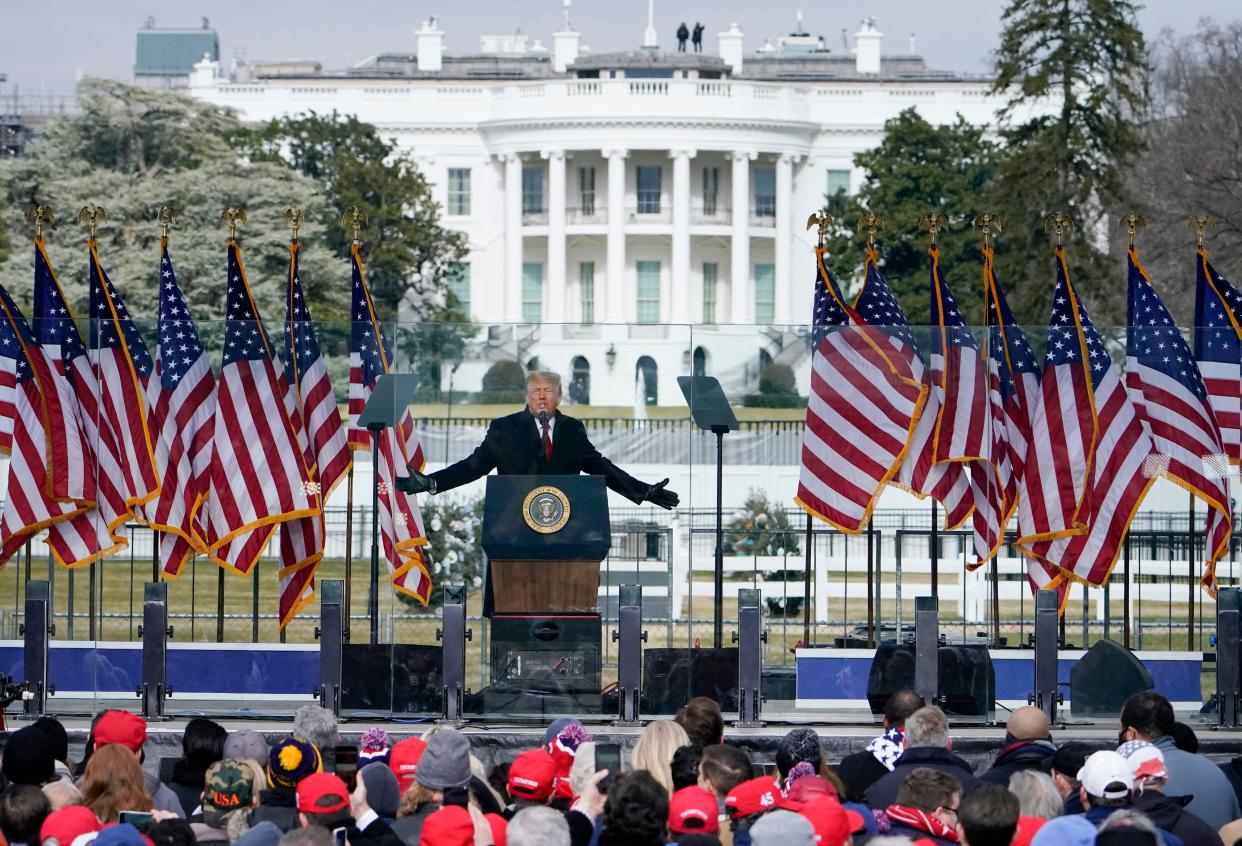 The White House in the background, President Donald Trump speaks at a rally in Washington on Jan. 6.