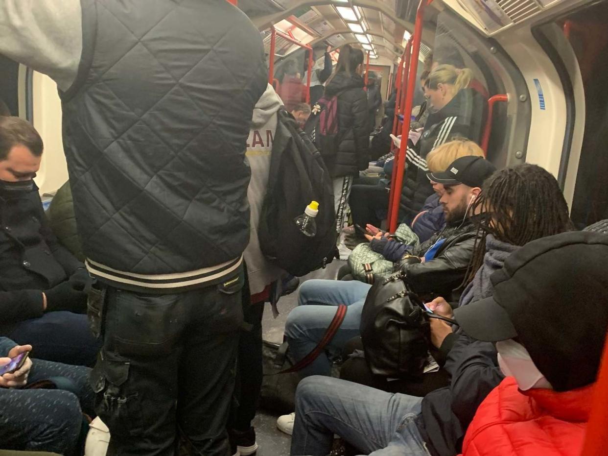 Handout photo taken with permission from the Twitter feed of @ajadmiah2 showing a carriage on the Central Line packed with commuters: PA