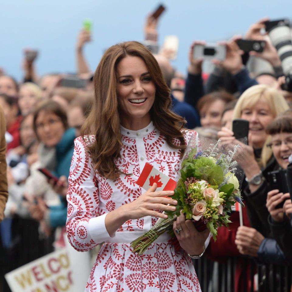 The Duchess of Cambridge as she receives flowers as she arrives at Jack Poole Plaza in Vancouver, B.C., Sunday, Sept. 25, 2016. THE CANADIAN PRESS/Jonathan Hayward