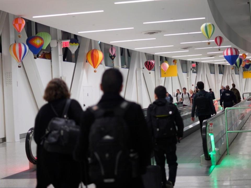 Travelers make their way to terminal 5 at JFK Airport in October 2019.