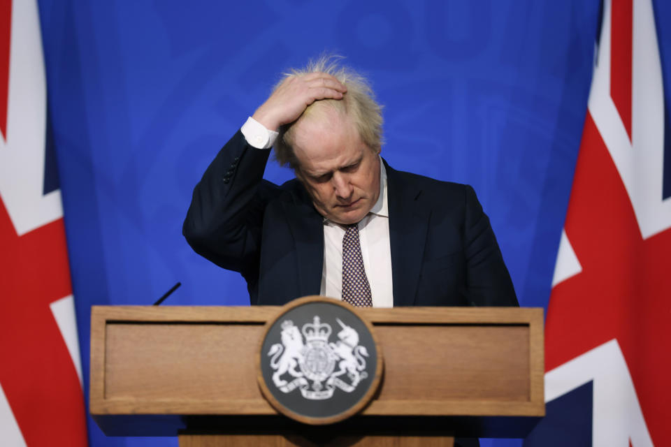 FILE - Britain's Prime Minister Boris Johnson gestures as he speaks during a press conference in London, Saturday Nov. 27, 2021, after cases of the new COVID-19 variant were confirmed in the UK. Johnson was dealt a major blow Tuesday, July 5, 2022, when two of his most senior Cabinet ministers quit, saying they had lost confidence in Johnson’s leadership. (Hollie Adams/Pool via AP, File)