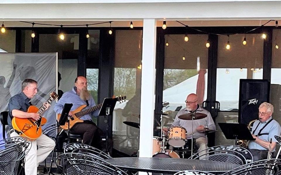 Members of the Jim Rice Group, from left, Phil Eversden, guitar; Dana Gillen, bass guitar; Joe Tuckey, drums; and Jim Rice, saxophone, play at the May Mingle, a fundraiser for Community Learning Connections, in 2022.
