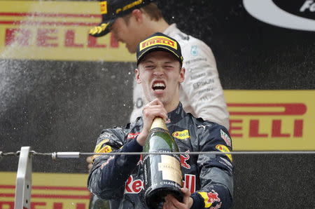 Formula One - Chinese F1 Grand Prix - Shanghai, China - 17/4/16 - Red Bull Formula One driver Daniil Kvyat of Russia celebrates after the Chinese Grand Prix. REUTERS/Aly Song