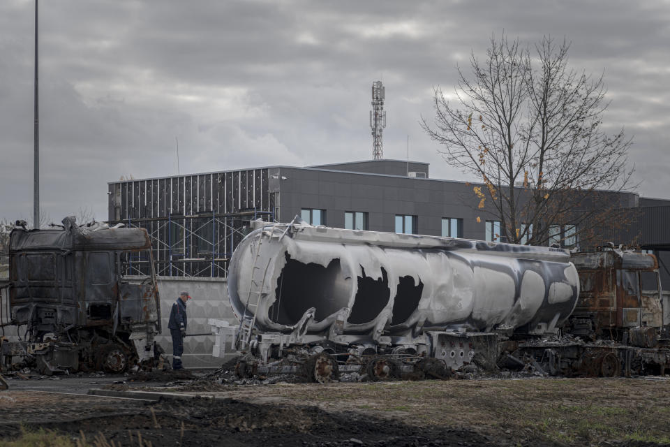 A view of a fuel depot hit by Russian missile in the town of Kalynivka, about 30 kilometers (18 miles) southwest of Kyiv, Ukraine, Thursday, Oct. 27, 2022. Environmental damage caused by Ukraine's war is mounting in the 8-month-old conflict, and experts warn of long-term health consequences for the population. (AP Photo/Andrew Kravchenko)
