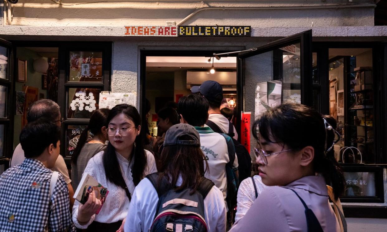 <span>A sign reads 'Ideas are bulletproof’ over the door of the Mount Zero bookshop on its last day of business.</span><span>Photograph: Louise Delmotte/AP</span>