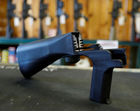 FILE PHOTO: A bump fire stock that attaches to a semi-automatic rifle to increase the firing rate is seen at Good Guys Gun Shop in Orem, Utah, U.S., October 4, 2017. REUTERS/George Frey/File Photo