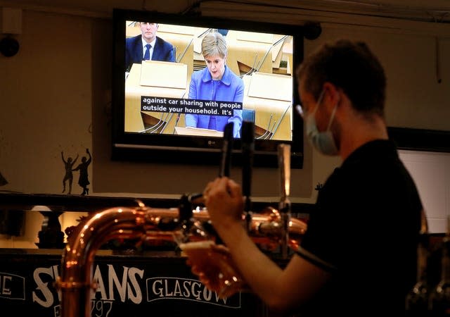 Nicola Sturgeon on TV in a pub