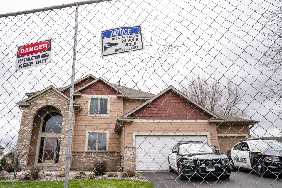 Fencing and concrete barriers surround the home of former Brooklyn Center police officer Kim Potter as local police guard her residence, Wednesday, April 14, 2021, in Champlin, Minn. A prosecutor said Wednesday that he will charge Potter, a white former suburban Minneapolis police officer with second-degree manslaughter for killing 20-year-old Black motorist Daunte Wright in a shooting that ignited days of unrest and clashes between protesters and police. (AP Photo/John Minchillo)