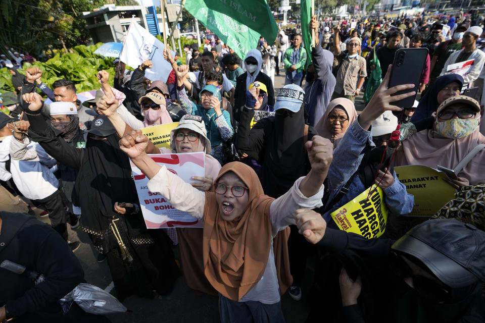 Protesters shout slogans during a rally against sharp increases in fuel prices in Jakarta, Indonesia, Monday, Sept. 12, 2022. Hundreds of conservative Muslims marched in Indonesia's capital on Monday demanding that the government revoke its decision to raise fuel prices, saying it hurts people already reeling from the economic impact of the pandemic. (AP Photo/Achmad Ibrahim)