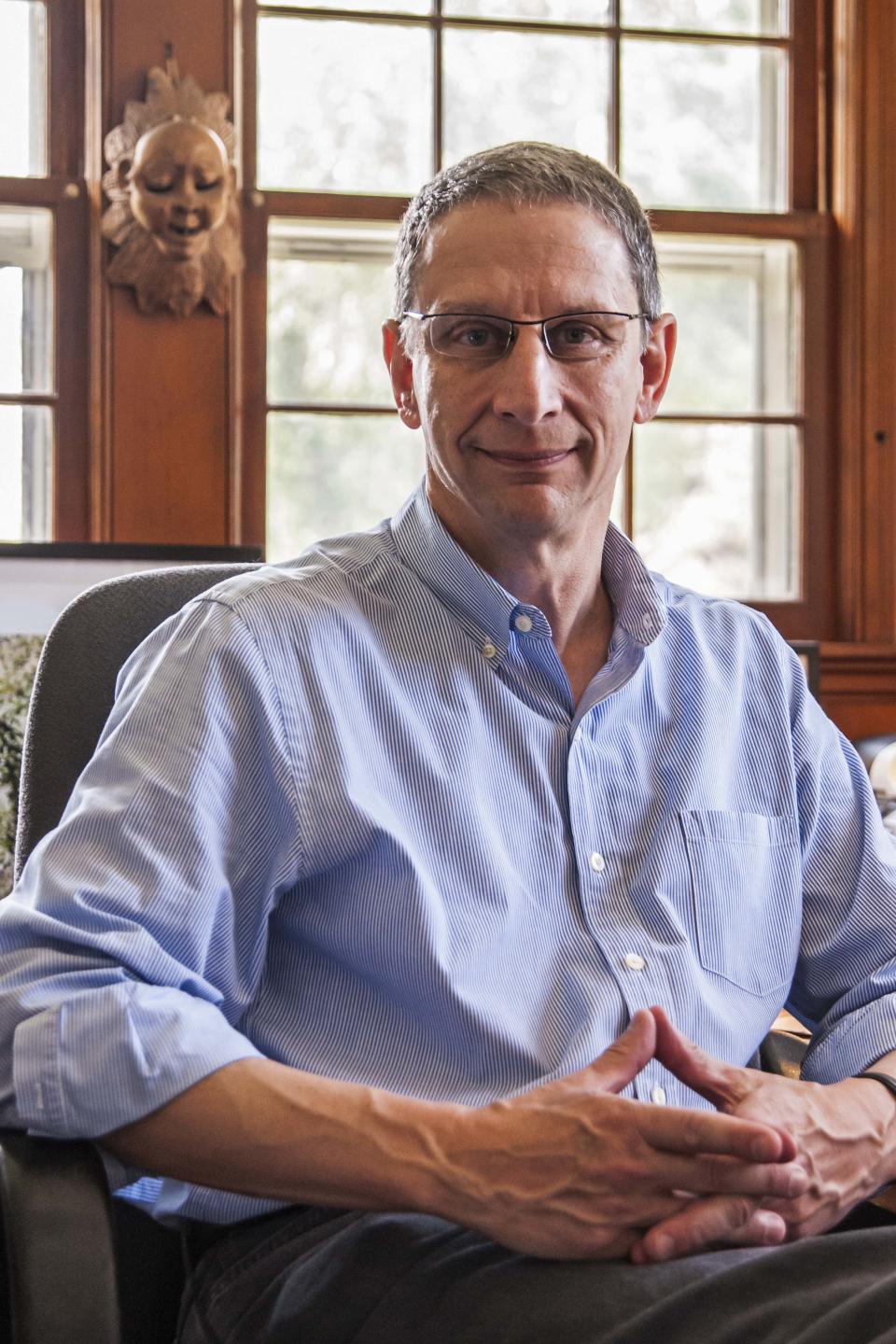 In this Sept. 19, 2012 photo provided by the Chicago-based John D. and Catherine T. MacArthur Foundation, David Finkel, 56, a Washington Post journalist whose long-form news writing has transformed readers’ understanding of military service and sacrifice, is seen at his home in Silver Spring, Md. Finkel is among 23 recipients of this year's MacArthur Foundation "genius grants." (AP Photo/Courtesy of the John D. and Catherine T. MacArthur Foundation, John Spaulding)
