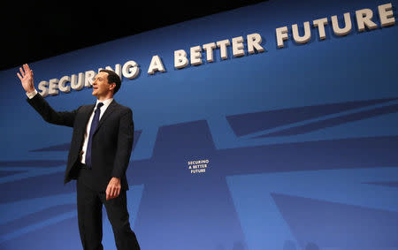 Britain's Chancellor George Osborne waves after his speech on the second day of the Conservative Party Conference in Birmingham central England September 29, 2014. REUTERS/Luke MacGregor
