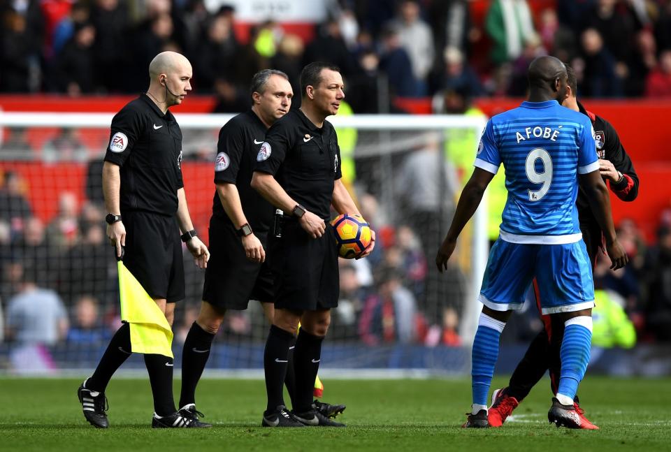 Benik Afobe challenges the officials after Andrew Surman's red card 
