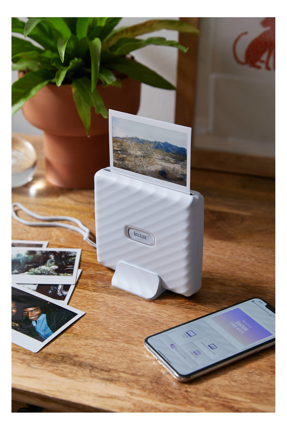 <p><a href="https://go.redirectingat.com?id=74968X1596630&url=https%3A%2F%2Fwww.urbanoutfitters.com%2Fshop%2Ffujifilm-wide-link-smartphone-printer&sref=https%3A%2F%2Fwww.redbookmag.com%2Flife%2Ffriends-family%2Fg44450245%2Fphoto-gifts%2F" rel="nofollow noopener" target="_blank" data-ylk="slk:Shop Now;elm:context_link;itc:0;sec:content-canvas" class="link ">Shop Now</a></p><p>Fujifilm Wide Link Smartphone Printer</p><p>$150.00</p><p>urbanoutfitters.com</p>