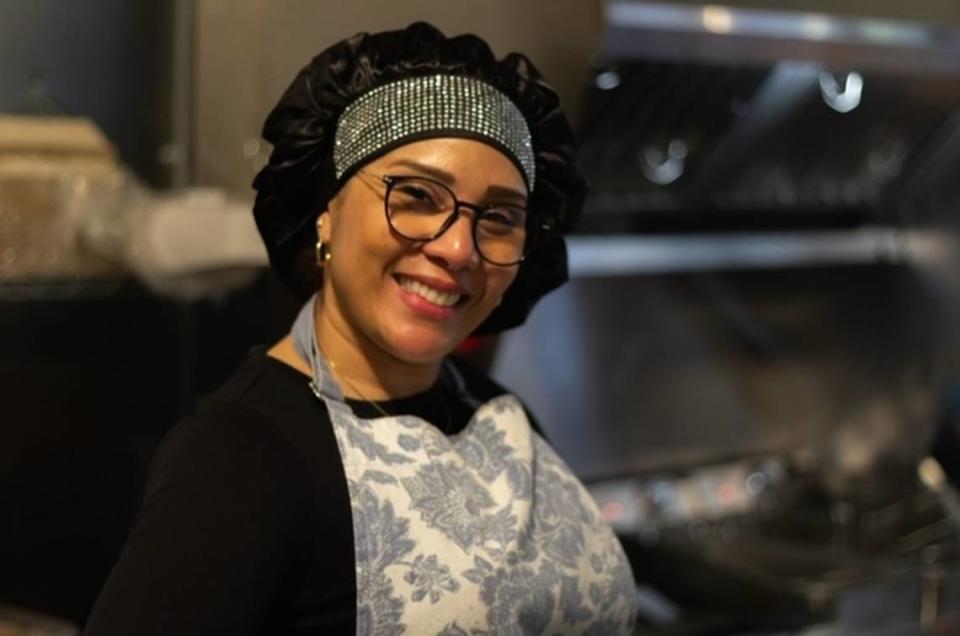 Owner Marly Machacon Villarreal greets guests with a warm welcome as she prepares their food in the kitchen. Jacquelyn Jimenez Romero/WA Latino News