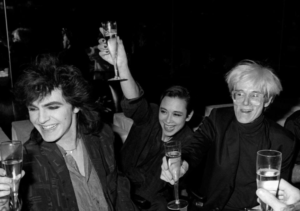 <p>At the same party, Nick Rhodes and a guest raise a glass in celebration of Warhol. </p>