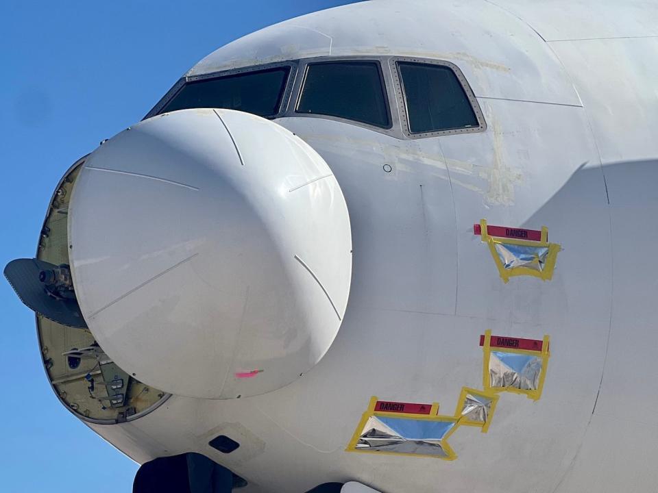 An employee working on an aircraft at Pinal Airpark.