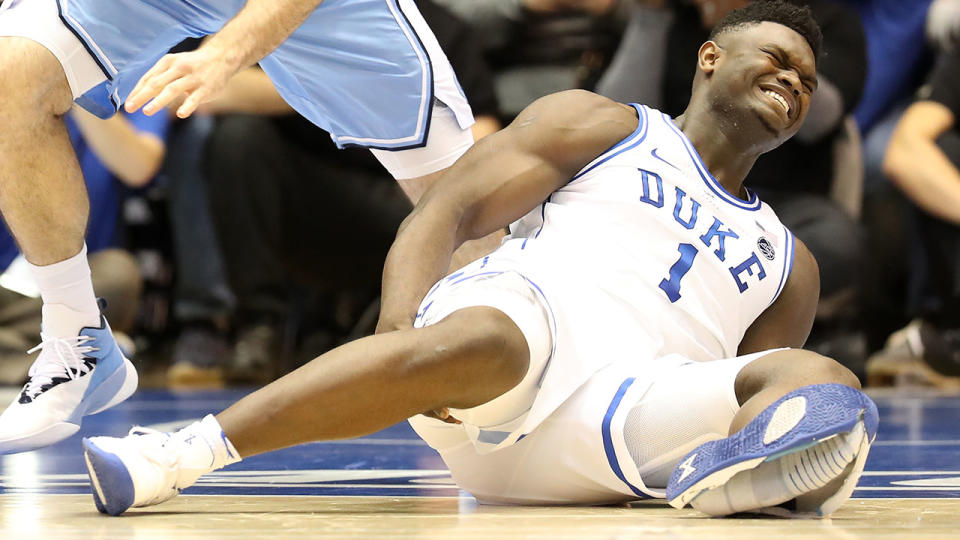 Zion Williamson of the Duke Blue Devils reacts after falling as his shoe breaks. (Photo by Streeter Lecka/Getty Images)