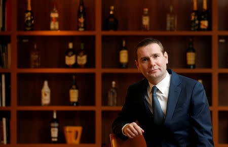 FILE PHOTO: Alexandre Ricard, Chairman and Chief Executive Officer of French drinks maker Pernod Ricard, poses at the company headquarters in Paris, February 12, 2015. REUTERS/Christian Hartmann/File Photo