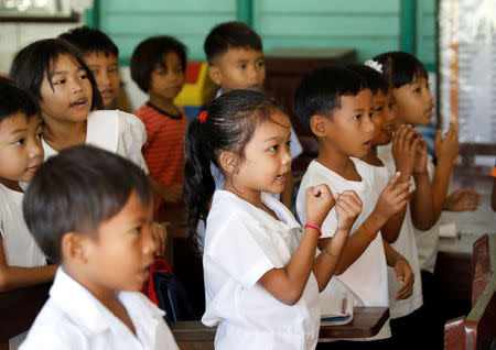 Schoolchildren attend classes in the mining town of Sta Cruz Zambales in northern Philippines February 8, 2017. REUTERS/Erik De Castro