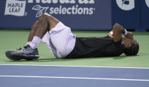 Gael Monfils, of France, lies on the court in pain following an injury during his match against Jack Draper, of Britain, during the National Bank Open tennis tournament Thursday, Aug. 11, 2022, in Montreal. (Paul Chiasson/The Canadian Press via AP)