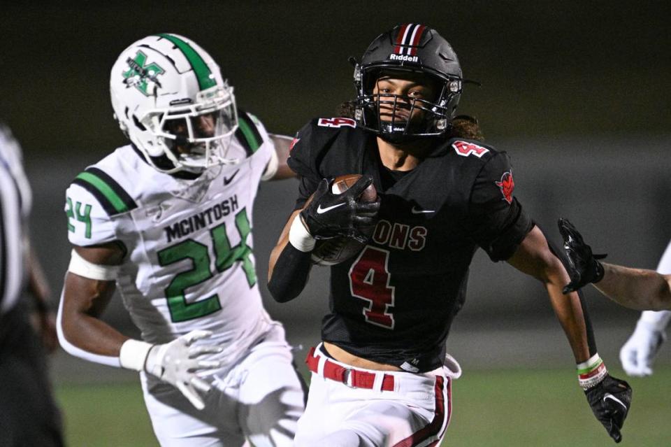 Warner Robins Demon Isiah Canion heads for the endzone for a touchdown in first quarter action against McIntosh.