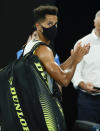 United States' Michael Mmoh walks from Rod Laver Arena following his second round loss to Spain's Rafael Nadal at the Australian Open tennis championship in Melbourne, Australia, Thursday, Feb. 11, 2021.(AP Photo/Rick Rycroft)