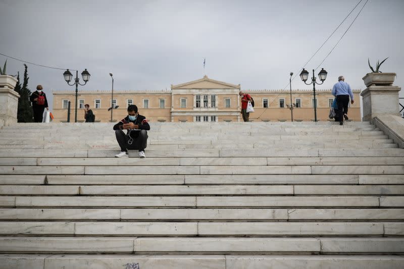 People wearing protective face masks are seen on Syntagma square, amid the coronavirus disease (COVID-19) pandemic