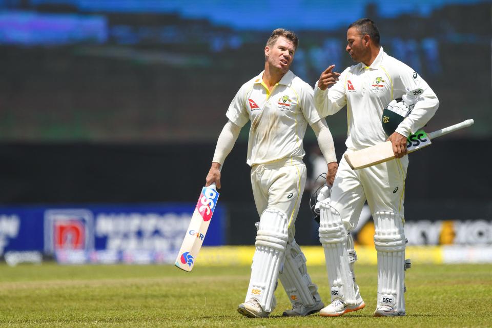 Australia's David Warner (pictured left) and Usman Khawaja (picxtured right) walk back to the pavilion.