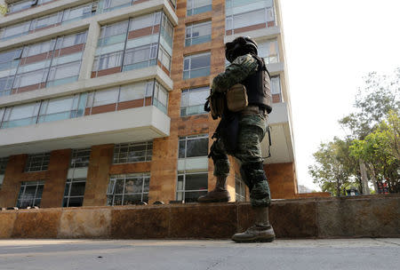 A soldier stands guard outside the building where accused drug kingpin Damaso Lopez, nicknamed “The Graduate", was arrested in Mexico City, Mexico May 2, 2017. REUTERS/Henry Romero