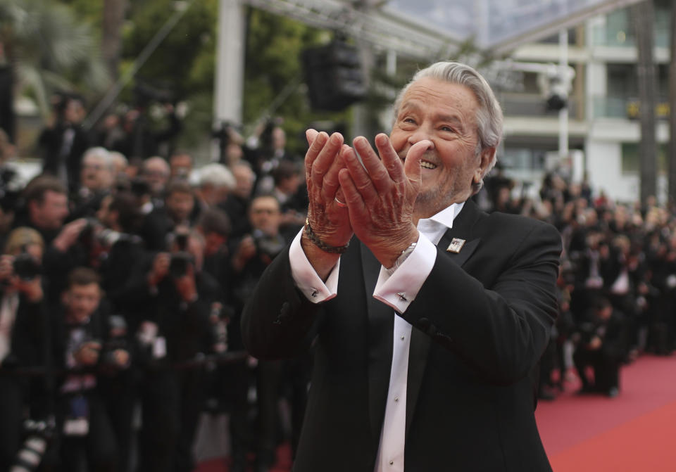 <p>FILE - In this May 19, 2019 file photo, French actor Alain Delon poses for photographers upon arrival at the premiere of the film 'A Hidden Life' at the 72nd international film festival, Cannes, southern France. Alain Delon, the internationally acclaimed French actor who embodied both the bad guy and the policeman and made hearts throb around the world, has died at age 88, French media reported. (AP Photo/Petros Giannakouris, File)</p>
