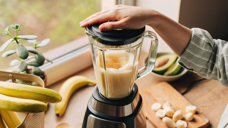 woman using blender