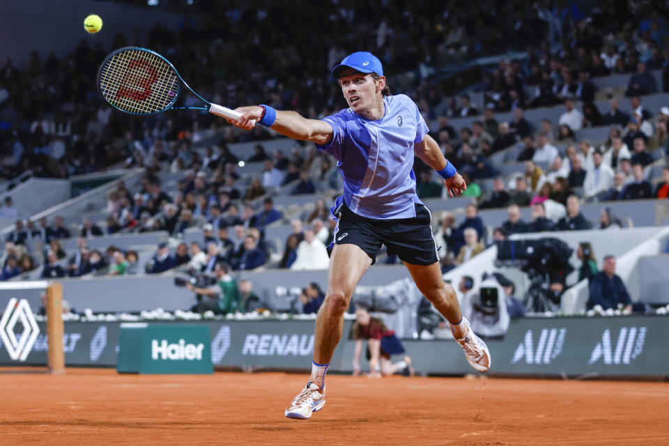 Australia's Alex De Minaur plays a shot against Germany's Alexander Zverev during their quarterfinal match of the French Open tennis tournament at the Roland Garros stadium in Paris, Wednesday, June 5, 2024. (AP Photo/Jean-Francois Badias)