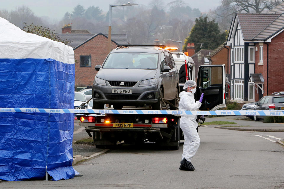 Police forensic officers at the property where a tent has been erected and a car taken away, New Zealand Lane, Duffield.  January 1, 2020.  See SWNS story SWMDpolice.  A man has been arrested on suspicion of a double murder after two people were found dead at a property on a quiet village road in the early hours of New Year's Day.  Police were called to a house on New Zealand Lane, in Duffield, Derbys., at 4.11am and found a man and a woman fatally injured inside.  A man was arrested at the scene on suspicion of two counts of murder and remains in custody this morning (Wed). A section of the street is closed while a small area of shops is also cordoned off and officers are expected to remain at the scene all day.  Forensic specialist teams have set up a blue tent and could be seen investigating a four-bedroom detached property, which sold in June 2014 for £295,000.  One resident said they heard screaming and shouting at around 3am and someone yelling: "They're dead! What have you f**king done?"  