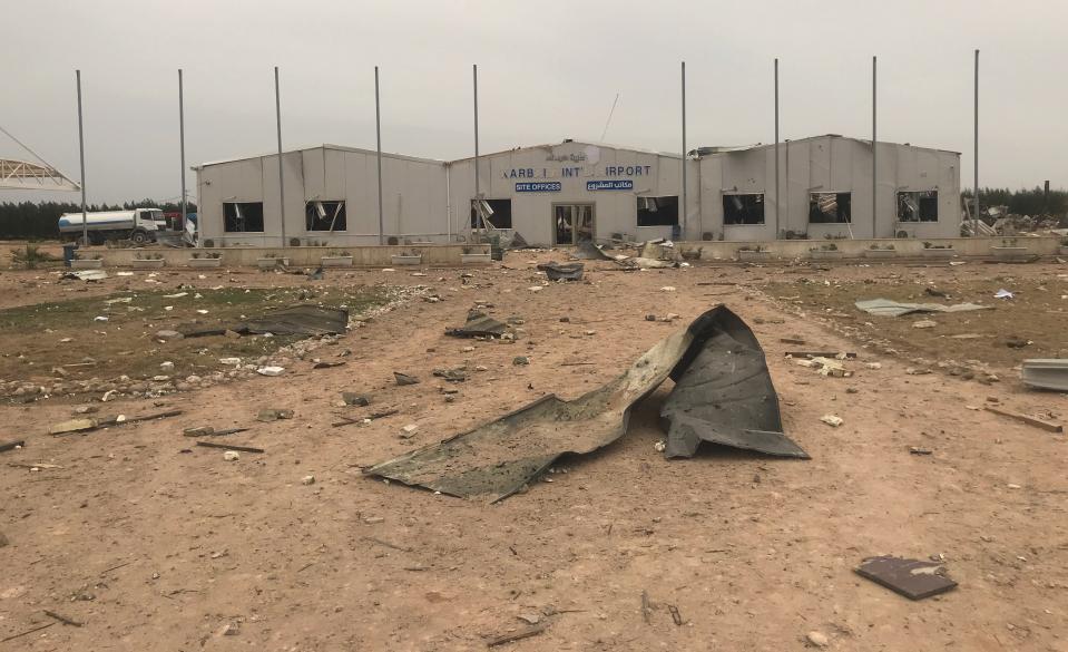 Destroyed buildings are seen at an airport complex under construction in Karbala, Iraq, Friday, March 13, 2020. Iraq's military said five security force members and a civilian were killed early Friday in a barrage of U.S. airstrikes, which were launched hours after a rocket attack killed and wounded American and British servicemen at a base north of Baghdad. (AP Photo/Anmar Khalil)