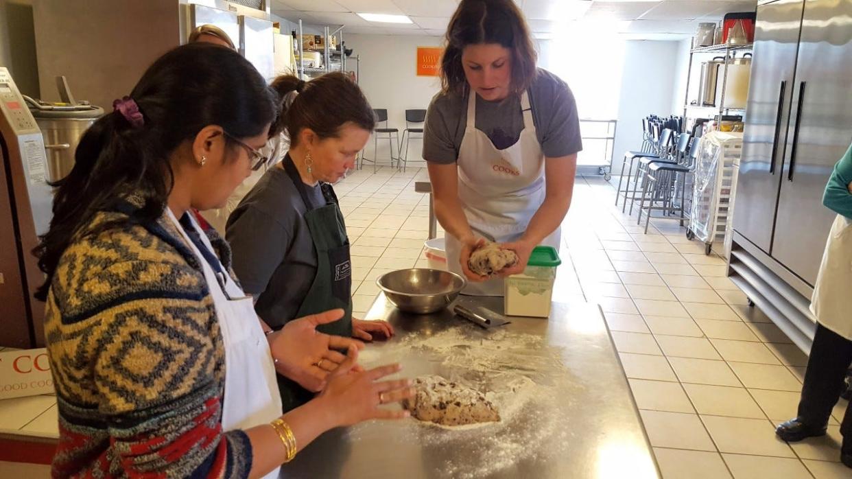 Leah Rosin-Pritchard, standing, teaches at Newport Cooks culinary school in 2019.