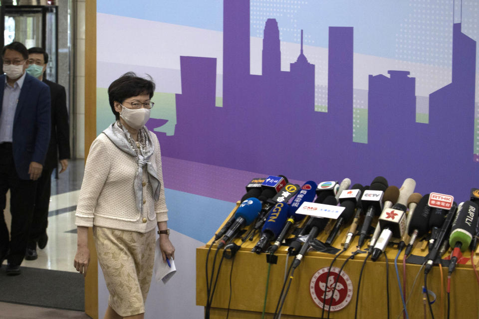 Hong Kong Chief Executive Carrie Lam arrives for a press conference after meeting Chinese leadership in Beijing on Wednesday, June 3, 2020. British Prime Minister Boris Johnson said the United Kingdom stands ready to open the door to almost 3 million Hong Kong citizens, as the city's leader arrived in Beijing on Wednesday for meetings on a planned national security law that has many worried about their future. (AP Photo/Ng Han Guan)