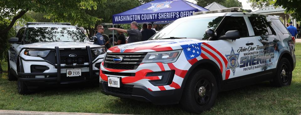 The Washington County Sheriff's Office recently had the department vehicle used by Public Information Officer Sgt. Carly Hose wrapped to help market recruitment efforts. That vehicle, on the right, was on display during National Night Out in Williamsport's Byron Park.