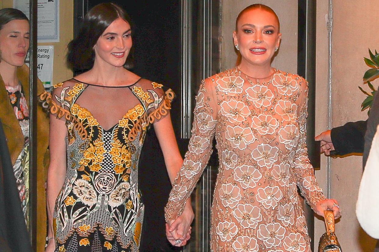 Lindsay Lohan and sister Aliana Lohan hold hands as leaving their hotel with family in New York City