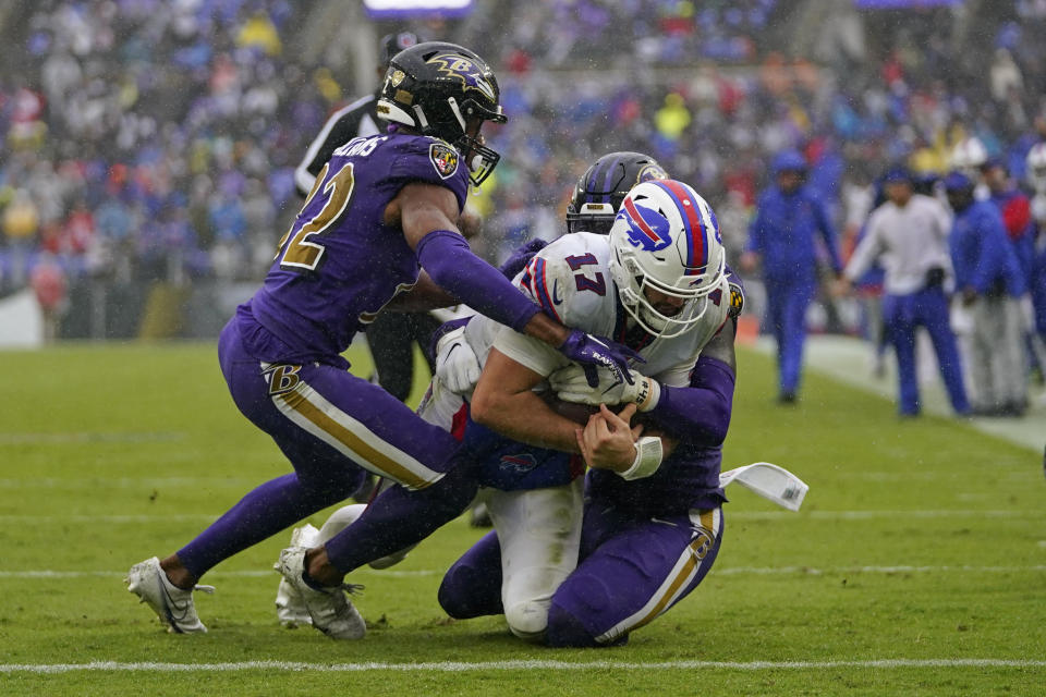 Buffalo Bills quarterback Josh Allen (17) scores a touchdown on an 11-yard run against the Baltimore Ravens. (AP Photo/Julio Cortez)