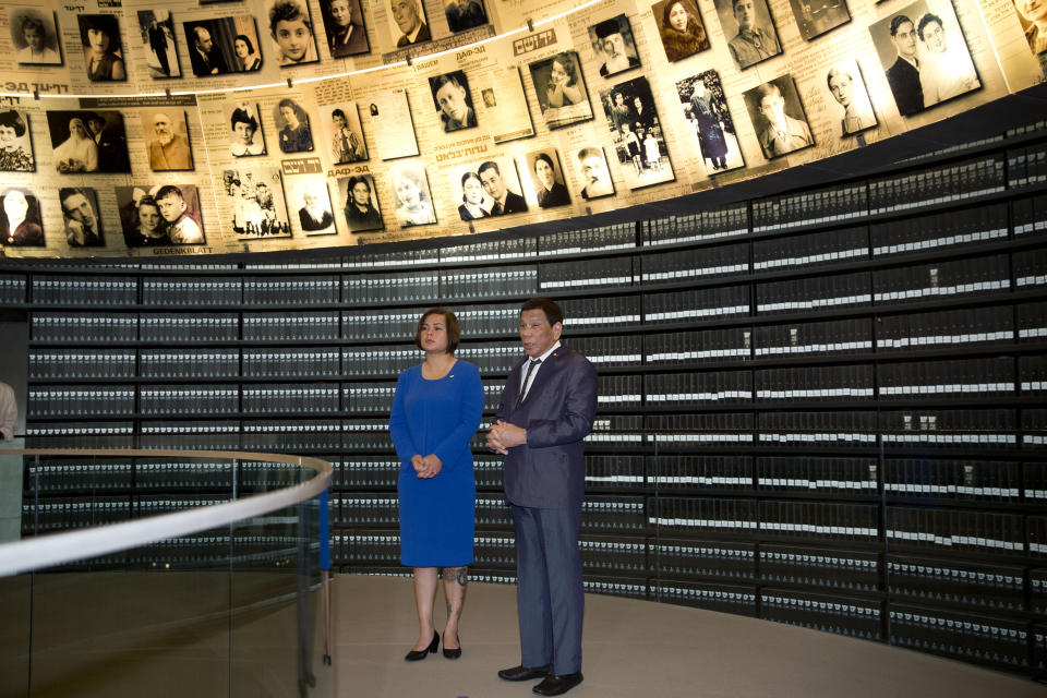 Philippine President Rodrigo Duterte and his daughter Sara visit the Hall of Names at the Yad Vashem Holocaust Memorial in Jerusalem, Monday, Sept 3, 2018. (AP Photo/Oded Balilty)