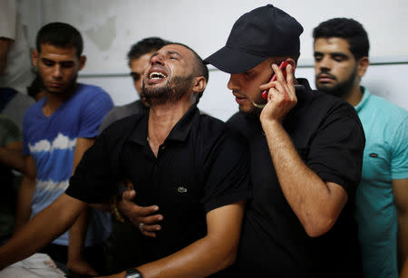 A relative of a Palestinian who was killed during a protest at the Israel-Gaza border fence, reacts in Gaza City September 28, 2018. REUTERS/Mohammed Salem