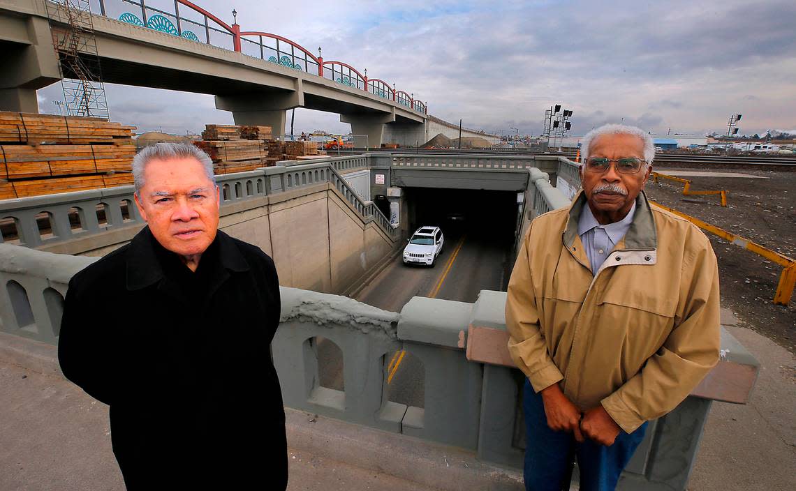Longtime Pasco residents Felix Vargas, left, and Dallas Barnes share stories about the Lewis Street underpass built in 1937 for the BNSF railroad tracks. The historic and very narrow underpass will soon be demolished.