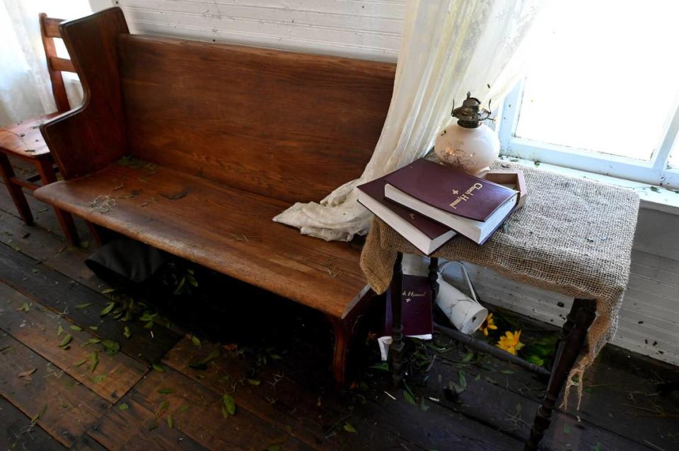 Erected in 1908, the Sandy Baptist Church in Myakka City withstood Hurricane Ian’s brutal winds, suffering some roof and window damage. Choir books were blown around, but the lace curtains still hung from the windows.